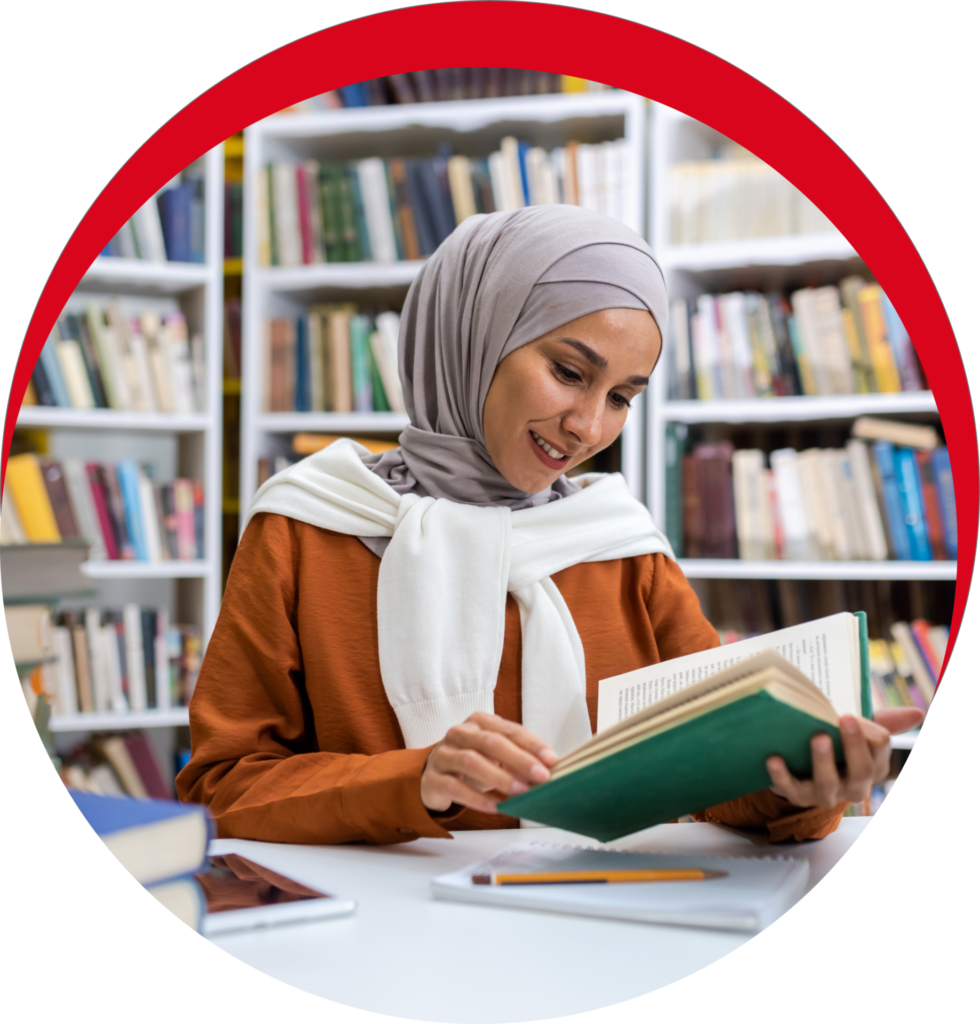 Muslim woman reading religious text as part of inclusive theological studies at Chicago Theological Seminary."