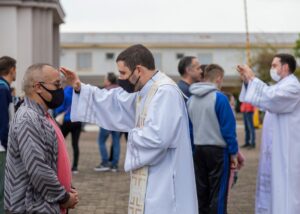 Priests offering blessings during a religious ceremony