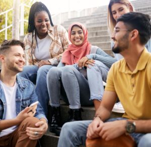 Diverse group of students sitting on steps, fostering inclusive learning at CTS